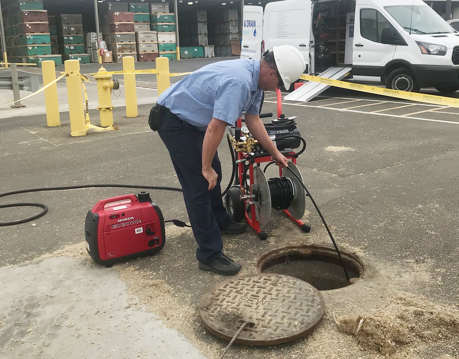 Drain cleaning company clearing a plugged drain in tri-cities WA